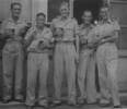Group, WW2, 5 soldiers enjoying a beer, standing outside, sleeves rolled up, some smoking: Left to right Fred Crosbie (19795), Eric Penno (80869), Jack Matheson (81317), Ben Letts (80680), Arthur Henderson. - This image may be subject to copyright