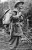 Portrait, Nigel MacKenzie Cotching, with rifle, back pack in countryside - This image may be subject to copyright