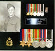 Framed portrait of Sapper Norm Leaf and his medals. - This image may be subject to copyright