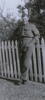 Portrait, Ronald McNaughton standing leaning against a picket fence, hands in pockets - This image may be subject to copyright