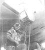 Portrait, dressed in flying clothes, climbing into a Mosquito aircraft ca.1941 - This image may be subject to copyright