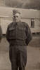 Portrait, standing outside barracks - This image may be subject to copyright