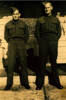 Family group, WW2, brothers in uniform, Edward James Doak (64369) left and William Doak (63931) (right) standing outside the front door of their home 16 Walls Road, Penrose, Auckland - This image may be subject to copyright
