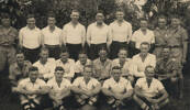 Group, WW2, A Company, 34th Battalion [Rugby] Football Team Back row, left to right: Ken, C. Bennett, W. Carey, A. Myers, Ron F. Bryers, H. C. Wynyard, S. G. Malaquin, H. Collins, Bob Rae. Middle row, left to right: [C. B. Connery not likely], Tex McGovern, Ken J. Hughes, T. V. Bedelph, Captain, Bart E. Innes, Leo Hand, Eddie Hazelton. [C. B. Connery probable] Front row, left to right: N. E. Lythe, H. Buscombe, W. J. Keith, R. J. H. Pickering, Charles E. Hazelton. - This image may be subject to copyright