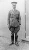 Portrait, Major F Ross full length, outside wooden building standing on gravel, cap, jodpurs, boots - No known copyright restrictions