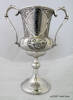 Zeerust Cup, back Inscription: ZEERUST. RUGBY LEAGUE CUP won by RIGHT SECTION N.Z. BATTERY WHILE ON ACTIVE SERVICE IN SOUTH AFRICA 1901. [names of team members top row] H.R. POTTER D. BYRNE; [lhs] A.C. BADDILEY A.G. PILLINGER (CAPT) T.W. LYONS H. BRAY E. BRADBURN J.A. McLEOD J.W.SMITH; [rhs] F. PETCHEL J. TAYLOR H. SMITH J.A. MCKEE E. POTTER C. HAMMOND W. URQUHART M.J. FLOOD; [bottom row] W.WHITTINGTON (LINE UMPIRE) (Auckland War Memorial Museum col.0337) - No known copyright restrictions - No known copyright restrictions