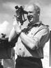Portrait, Norman using a sextant on board HMNZS Kaniere on duty in Korea. - This image may be subject to copyright