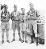 Group, 4 airmen wearing leis. L-R unknown, Jim Whyte, Ray Mellsop, Peter Day, Hawaii 1941 - Auckland War Memorial Museum - Tāmaki Paenga Hira PH-2004-59-1. This image may be subject to copyright.