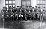 Large group soldiers seated, Fairlie in back row and is sixth from right. - No known copyright restrictions
