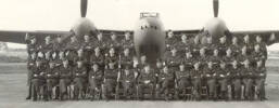 487 Squadron seated under Mosquito, Sculthorpe, October 1943. Hugh Mackay is 8th from the left in the back row. - This image may be subject to copyright