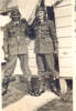 Group, 2 airmen, Levin 1941, Mervyn Jack Mills (NZ414321) and Alick Mewa (NZ414320) awhile at aircrew training in Levin in 1941, standing in front of Hut 98, wearing flying helmets, gloves and boots. (kindly provided by the family of M.J. Mills) - This image may be subject to copyright