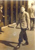 Portrait, Mills at the age of about 13 years, walking down Queen Street, Auckland - This image may be subject to copyright