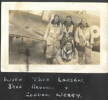 Airmen standing beside plane, Ronald (Torchy) S. Moore "with Thor Larssen, Jeff Reddell and Gordon Webby" (R.S. Moore album) - This image may be subject to copyright