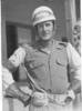 Portrait wearing motor bike uniform, helmet, gloves - This image may be subject to copyright