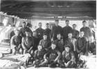 Group soldiers, inside barracks, Featherston Camp, one with an accordion. James is at left in the middle row. - No known copyright restrictions