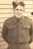 Portrait, WW2, soldier standing outside wooden building, Francis Nathaniel Harwood, c1940 - This image may be subject to copyright