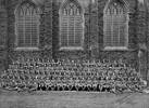 Group portrait of NCOs at training camp, photographed outside the chapel windows in Friar's Court at Queens College, Cambridge, UK July 1917. - No known copyright restrictions