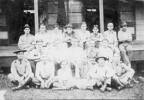 Group men of Unit Samoan Relief Force and one child in Samoa approximately 1917-1918, some in uniform. James W Burdett is the first on the left in the back row. - No known copyright restrictions