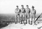 Group: 4 soldiers: Noel Gill, Bob Fleming, Ian Mackay, Colin Gibbard atop a pyramid in Egypt - This image may be subject to copyright