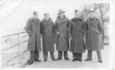 Group, WW2, 5 soldiers wearing great coats, (postcard stamped front) taken at Great Windsor Park, London after they arrived from NZ - hence the great coats. I know dad was in London through the 1940 blitz before they were sent out to Greece and Crete - This image may be subject to copyright