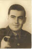 Portrait, serge jacket uniform, tie and holding a pipe (kindly provided by family) - This image may be subject to copyright