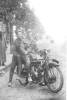 Charles Pratt seated on a motor cycle with an unidentified passenger [his brother?] photograph taken in a street, North Africa - No known copyright restrictions