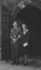 [Wedding photograph, WW2, standing at a church door, Archibald Carlisle Callander (NZ403422) and Pip, the bride wearing a suit and flowers across her lapel] - This image may be subject to copyright