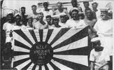 HMNZS Gambia, Gambians with a captured Japanese flag - This image may be subject to copyright