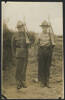 Group, 2 soldiers, standing at attention with rifles, Jackson Bray Penno (632826) left unknown soldier right - This image may be subject to copyright