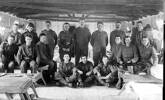 Group, WW1, Soldiers in uniform inside barracks, beds, tables. John Budge is third from the right, back row. - No known copyright restrictions