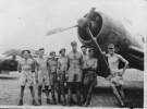 Group of 8 servicemen in front of Vought Corsair.: Matthew Handley is second from left in front of Vought Corsair. - This image may be subject to copyright