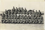 Group, formal photo in front of plane, 1943 Morley front row, eighth from left, 1943. Waiting for posting to the United Kingdom. - This image may be subject to copyright