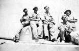Group, WW2, 5 soldiers on a tank: Sgt Stan Hughes, L/c Jock Mansell, Major G. Baker, Trooper Peter Bankham, Trooper Henry G.C. - This image may be subject to copyright