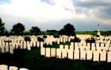 Gouzeaucourt New British Cemetery, view of graves and cross of sacrifice, colour photo - No known copyright restrictions