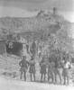 Group photo, in front of rubble: "Cassino after the push, June 1944." - This image may be subject to copyright