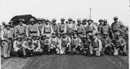 Group photo, WW2, informal, Specialist Tank Battalion at Christmas, Henry Campbell 5th from left kneeling in front row. - This image may be subject to copyright