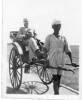 WW2 Ceylon, J G Heasley in a rickshaw, with pie in his mouth and his rickshaw driver (Heasley family album ) - No known copyright restrictions