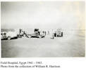 Field Hospital, Egypt, 1941-1943 showing Red Cross truck and tents, people. - This image may be subject to copyright