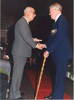 Medal Ceremony, Ronald Moore (NZ404554) receiving the Malta George Cross Fiftieth Anniversary Medal from Mr Abele, Consul for Malta in Tauranga in 1992 (front) - This image may be subject to copyright