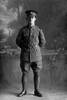 Full length portrait of Lance Corporal Adair of the 28th Reinforcements, probably (Corporal in the roll) George William Adair, Reg No 54797, E Company. (Photographer: Herman Schmidt, 1917). Sir George Grey Special Collections, Auckland Libraries, 31-A3984. No known copyright.