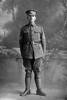 Full length portrait of Sergeant Major Beachem in full military uniform (Photographer: Herman Schmidt, 1916). Sir George Grey Special Collections, Auckland Libraries, 31-B63. No known copyright.