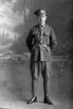 Full length portrait of Private Mervyn Roy Ashton, Reg No 42010, of the 6th (Hauraki) Regiment, Auckland Infantry Regiment, 23rd Reinforcements, - E Company. (Photographer: Herman Schmidt, 1917). Sir George Grey Special Collections, Auckland Libraries, 31-A2646. No known copyright.