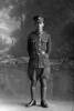 Full length portrait of Private Thomas Bertram Ashton of the Auckland Infantry Battalion, - A Company, 21st Reinforcements. (Photographer: Herman Schmidt, 1917). Sir George Grey Special Collections, Auckland Libraries, 31-A2648. No known copyright.