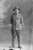Full portrait of Trooper Stanley Martyn Barriball, Reg No 43180, New Zealand Mounted Rifles, 26th Reinforcements. (Photographer: Herman Schmidt, 1917). Sir George Grey Special Collections, Auckland Libraries, 31-B3535. No known copyright.