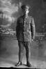 Full length portrait of Corporal John Samuel Davis, Reg No 23305, New Zealand Rifle Brigade, 13th Reinforcements, 7th Reinforcements to the 1st Battalion, E Company. (Photographer: Herman Schmidt, 1916). Sir George Grey Special Collections, Auckland Libraries, 31-D374. No known copyright.