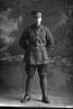 Full length portrait of Lieutenant A Dignan, New Zealand Signal Corps  [ls:37048] (Photographer: Herman Schmidt, 1916). Sir George Grey Special Collections, Auckland Libraries, 31-D395. No known copyright.