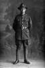 Full length portrait of Lance Corporal Leonard Booker, Reg No 55173, New Zealand Medical Corps. (Photographer: Herman Schmidt, 1917). Sir George Grey Special Collections, Auckland Libraries, 31-B3567. No known copyright.