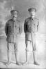 Full length portrait of Sapper William Coldicutt, Reg No 4/1244 (right), and Sapper Oswald Charles Cossey, Reg No 4/1251 (left) both of the New Zealand Tunnelling Company (Photographer: Herman Schmidt, 1915). Sir George Grey Special Collections, Auckland Libraries, 31-C311. No known copyright.