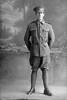 Full length portrait of Private Victor William Cunningham of the Auckland Infantry Battalion, - A Company, 12th Reinforcements. (Photographer: Herman Schmidt, 1916). Sir George Grey Special Collections, Auckland Libraries, 31-C1491. No known copyright.