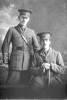 3/4 portrait of two men: one is 2nd Lieutenant Cecil James Kelly Cutler, Reg No 19088, and the other is 2nd Lieutenant Thomas Marshall Johnstone, Reg No 19086, both of the New Zealand Rifle Brigade, - J Company, 15th Reinforcements. Cutler died of disease in France 4 November 1916 (Photographer: Herman Schmidt, 1916). Sir George Grey Special Collections, Auckland Libraries, 31-C1495. No known copyright.